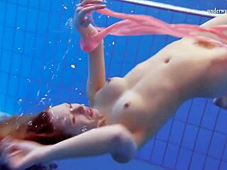 Katka Matrosova's naked swim in the pool with big tits and feet