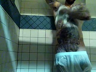Hardcore shower scene with a tattooed white guy and his big cock