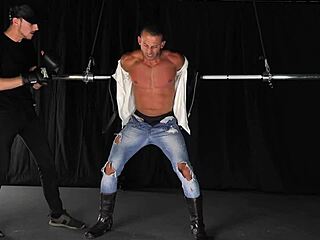 Gay bondage and whipping with a muscular submissive