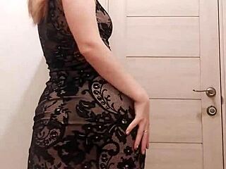 Mature woman in a dress pleasures herself with a dildo and touches her moist folds in the bathroom